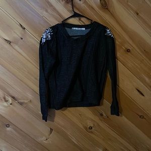 Black sweater with sequin shoulders